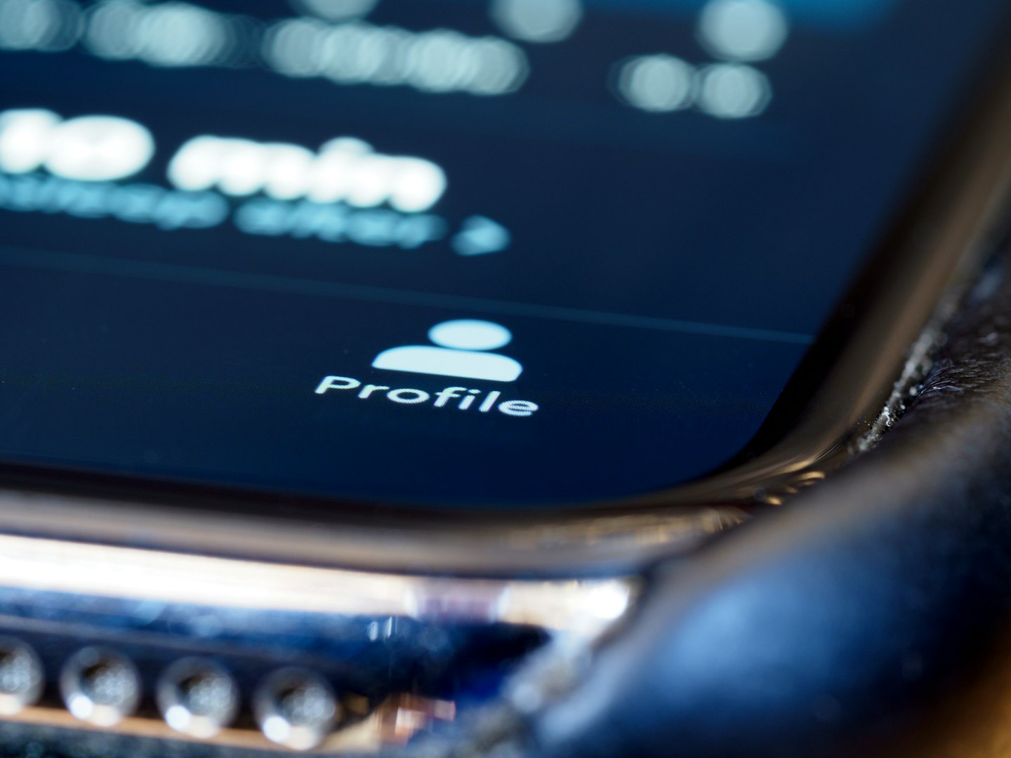 Smartphone screen displaying a white profile button and icon.
